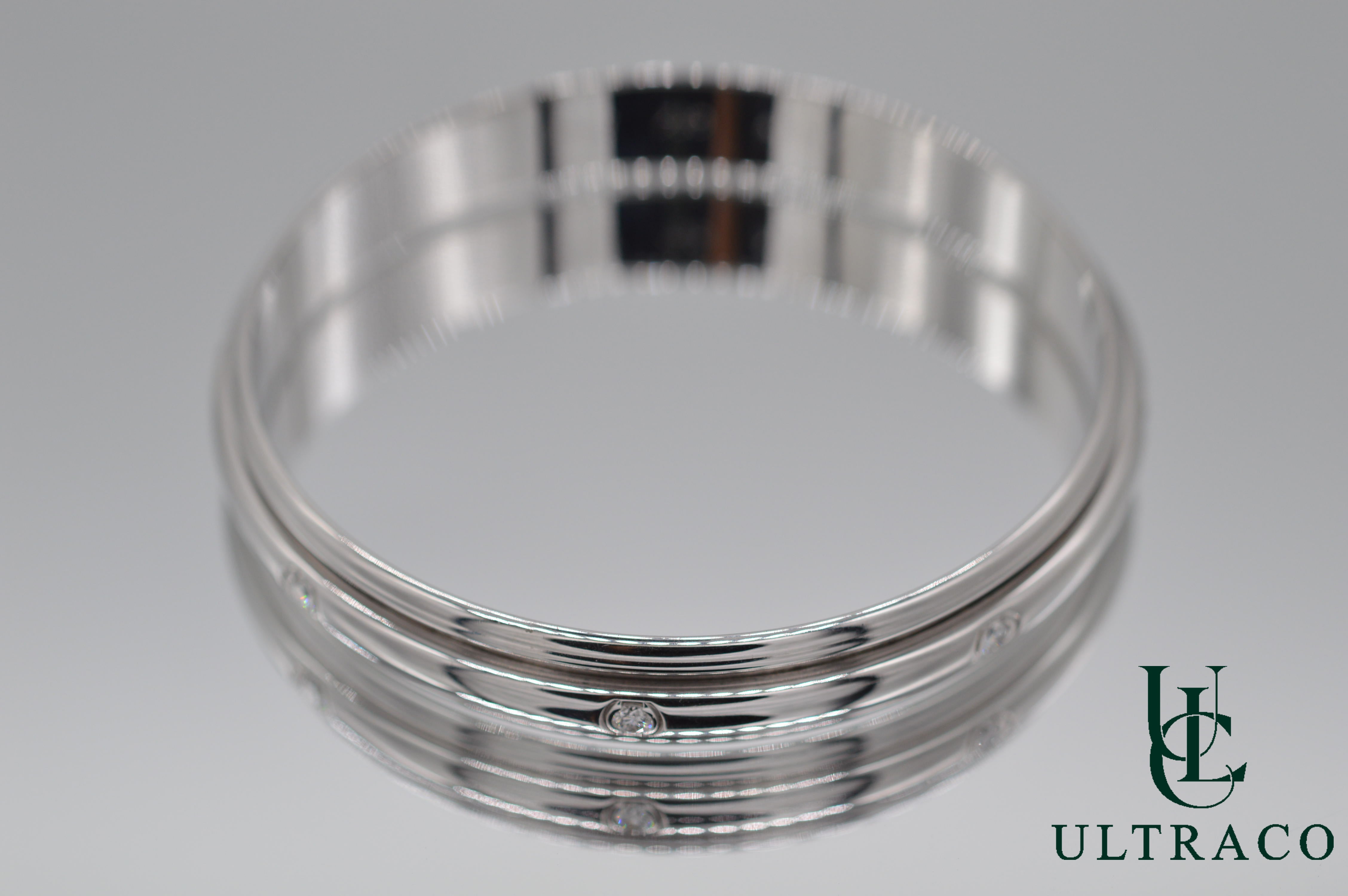 Bracelet jonc Piaget Possession Spinning serti de 8 diamants en or blanc 18 carats