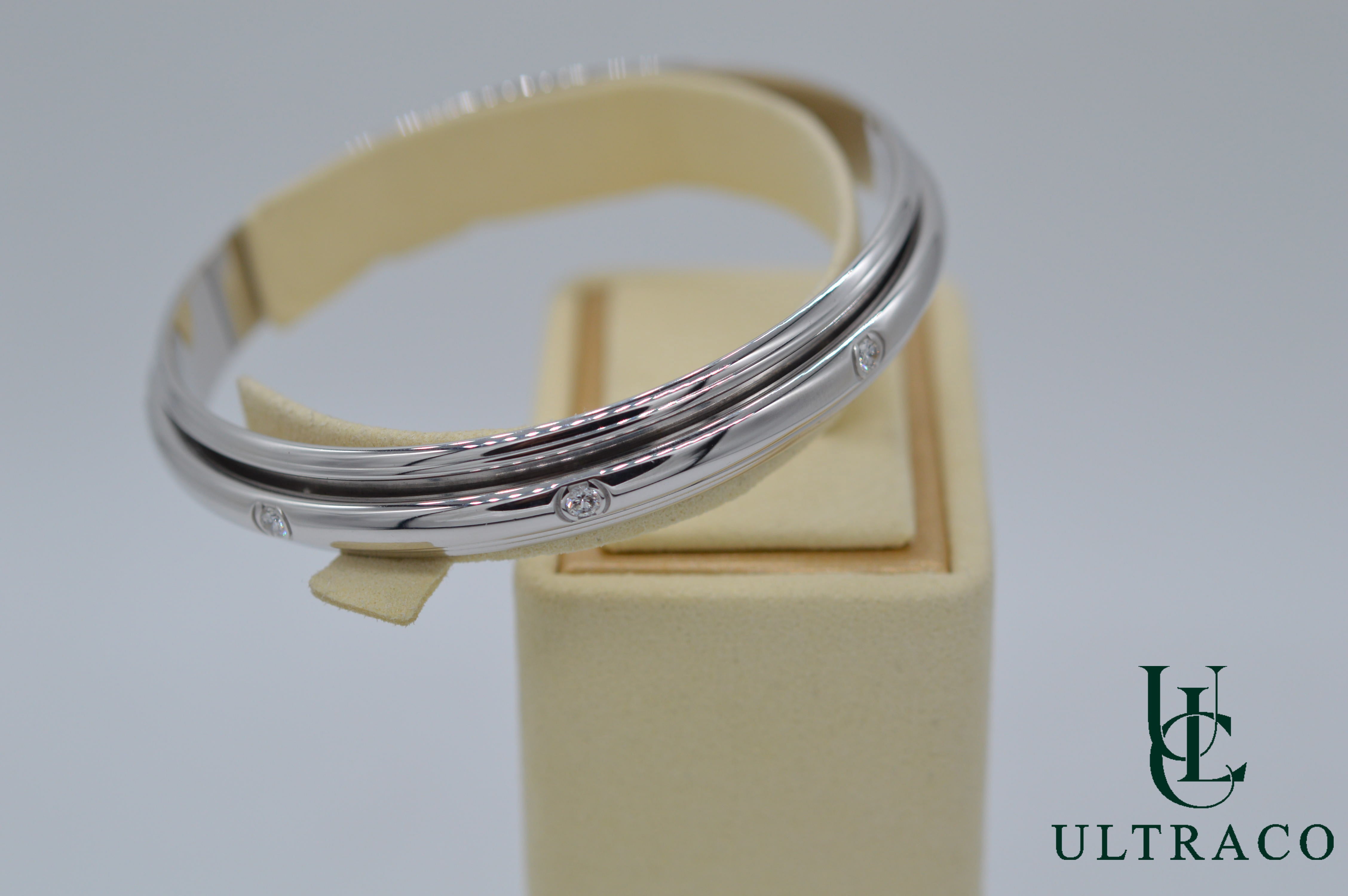 Bracelet jonc Piaget Possession Spinning serti de 8 diamants en or blanc 18 carats