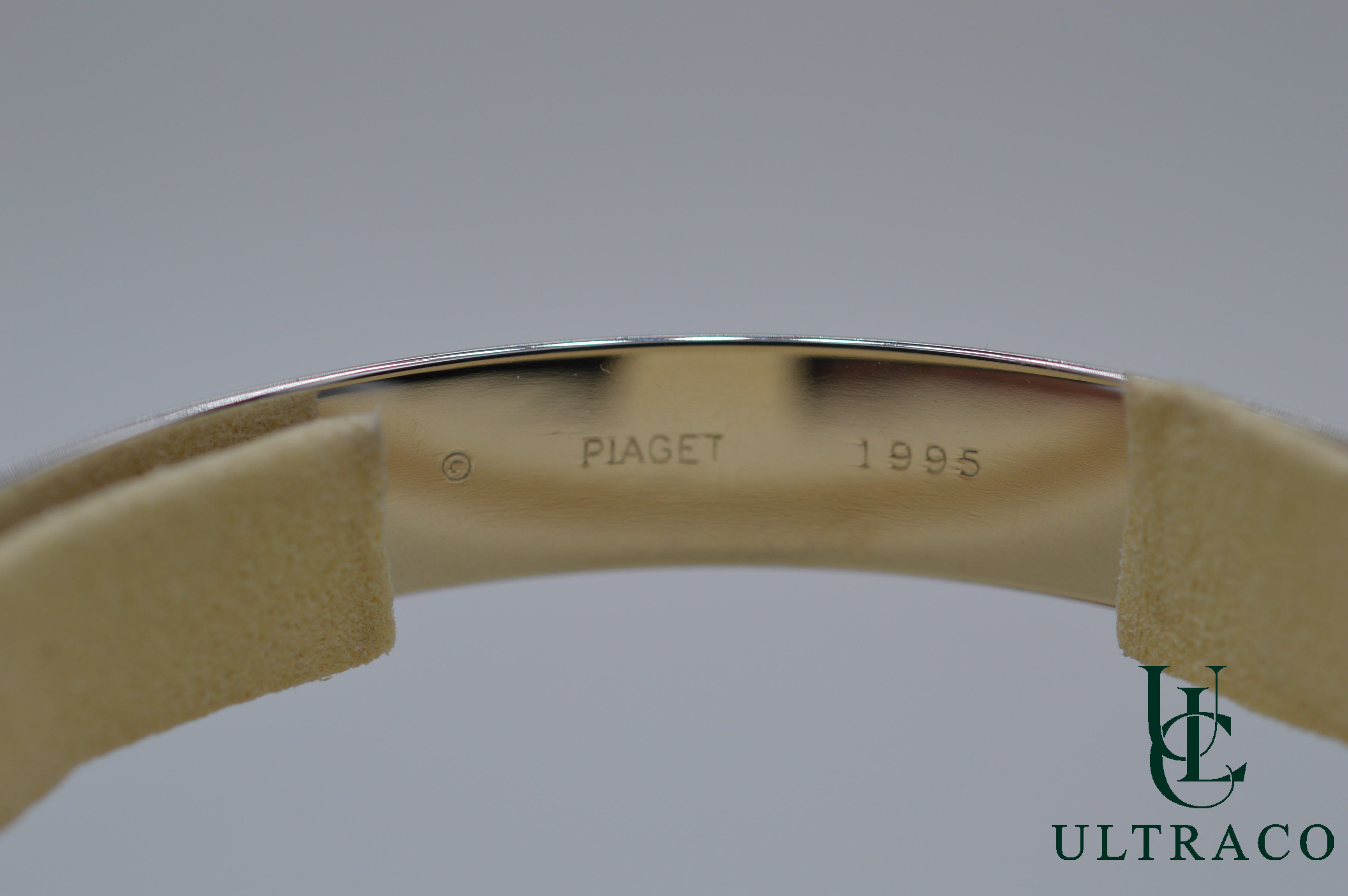 Bracelet jonc Piaget Possession Spinning serti de 8 diamants en or blanc 18 carats